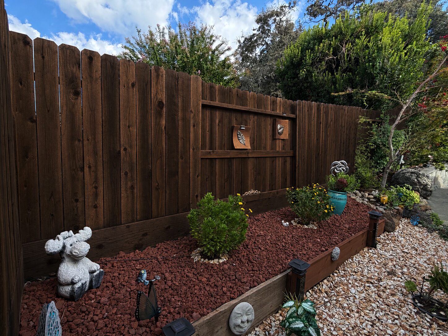 Freshly stained backyard fence in Rocklin, California